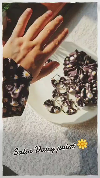 Daisy print hair scrunchies with matching bow earrings set  Black satin with white floral pattern